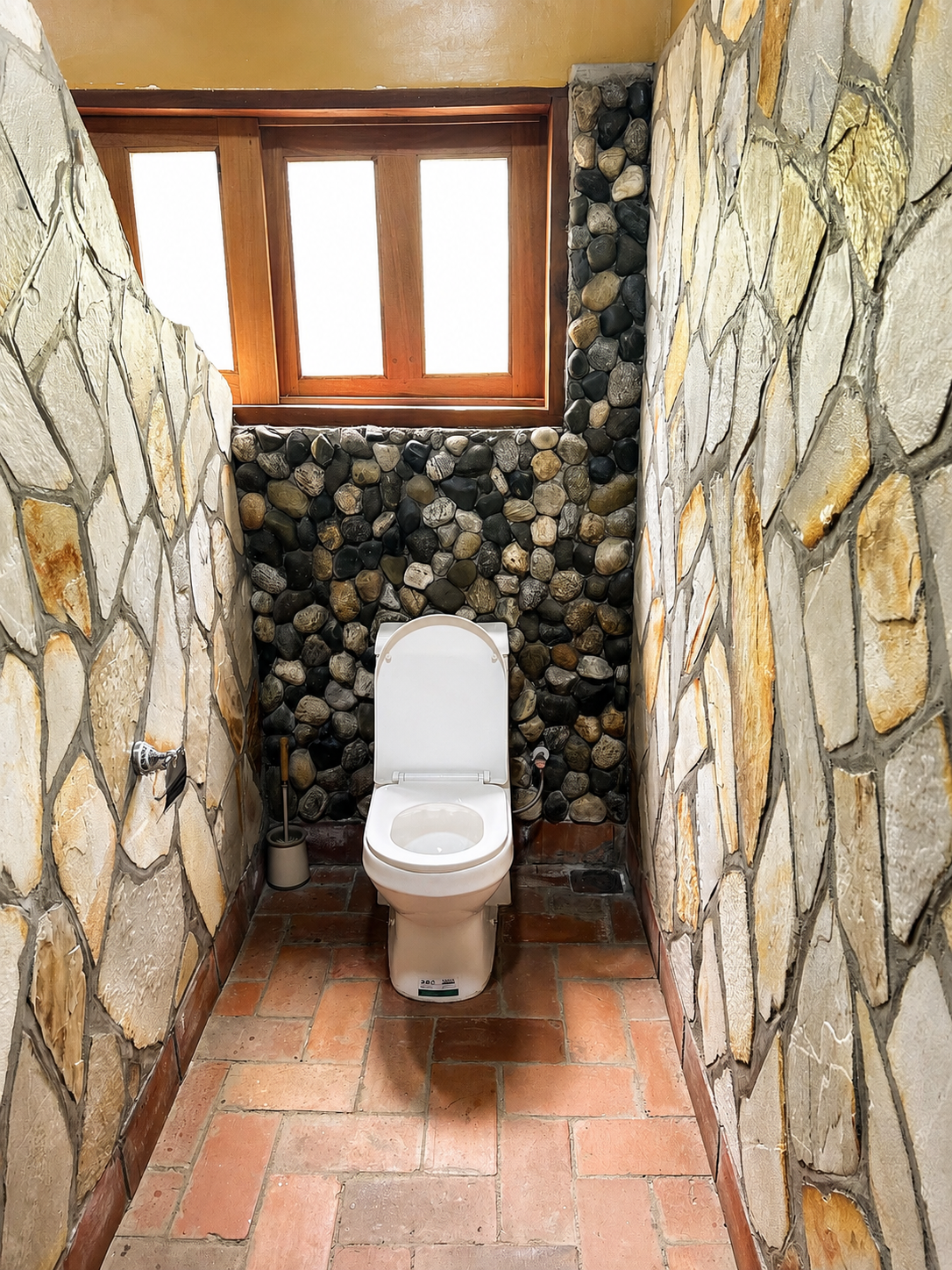 Imhotep banda ensuite toilet with stone walls at Warujojo Safari Lodge