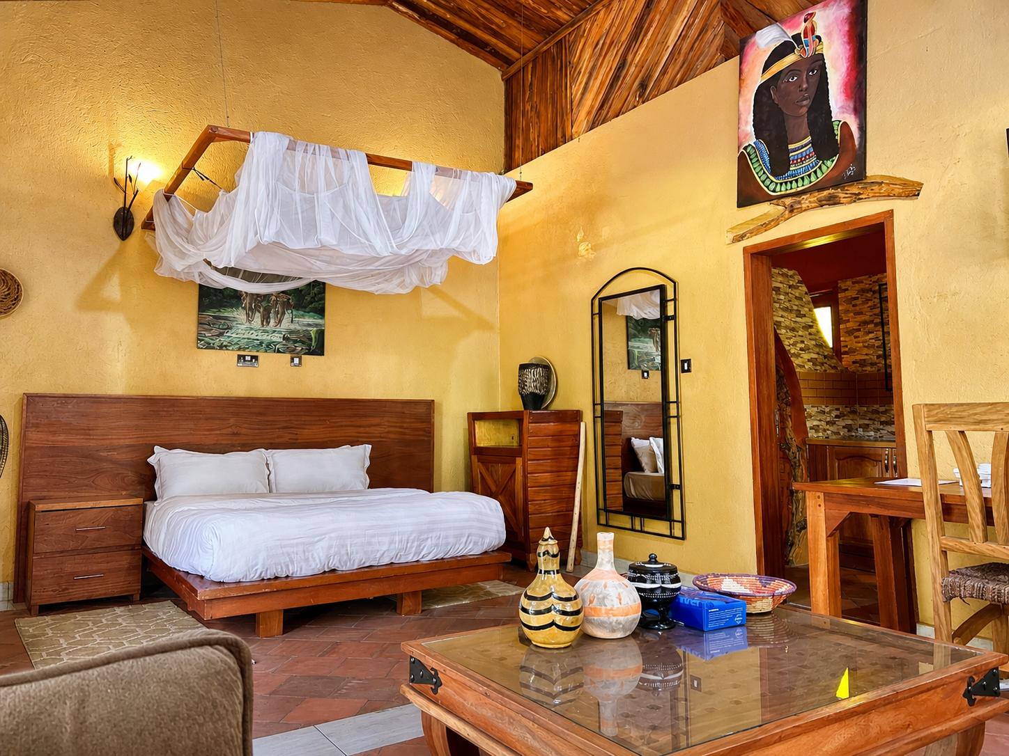 Karakara banda bedroom and lounge overview at Warujojo Safari Lodge