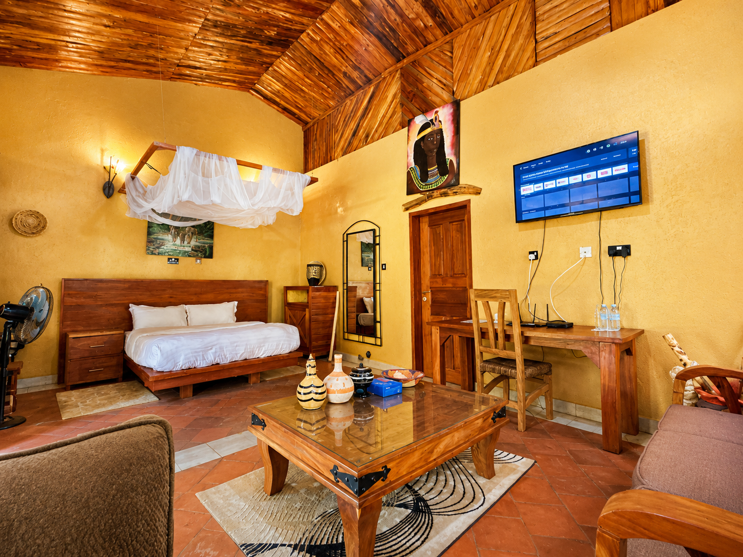 Karakara banda sofa and armchair in the lounge at Warujojo Safari Lodge