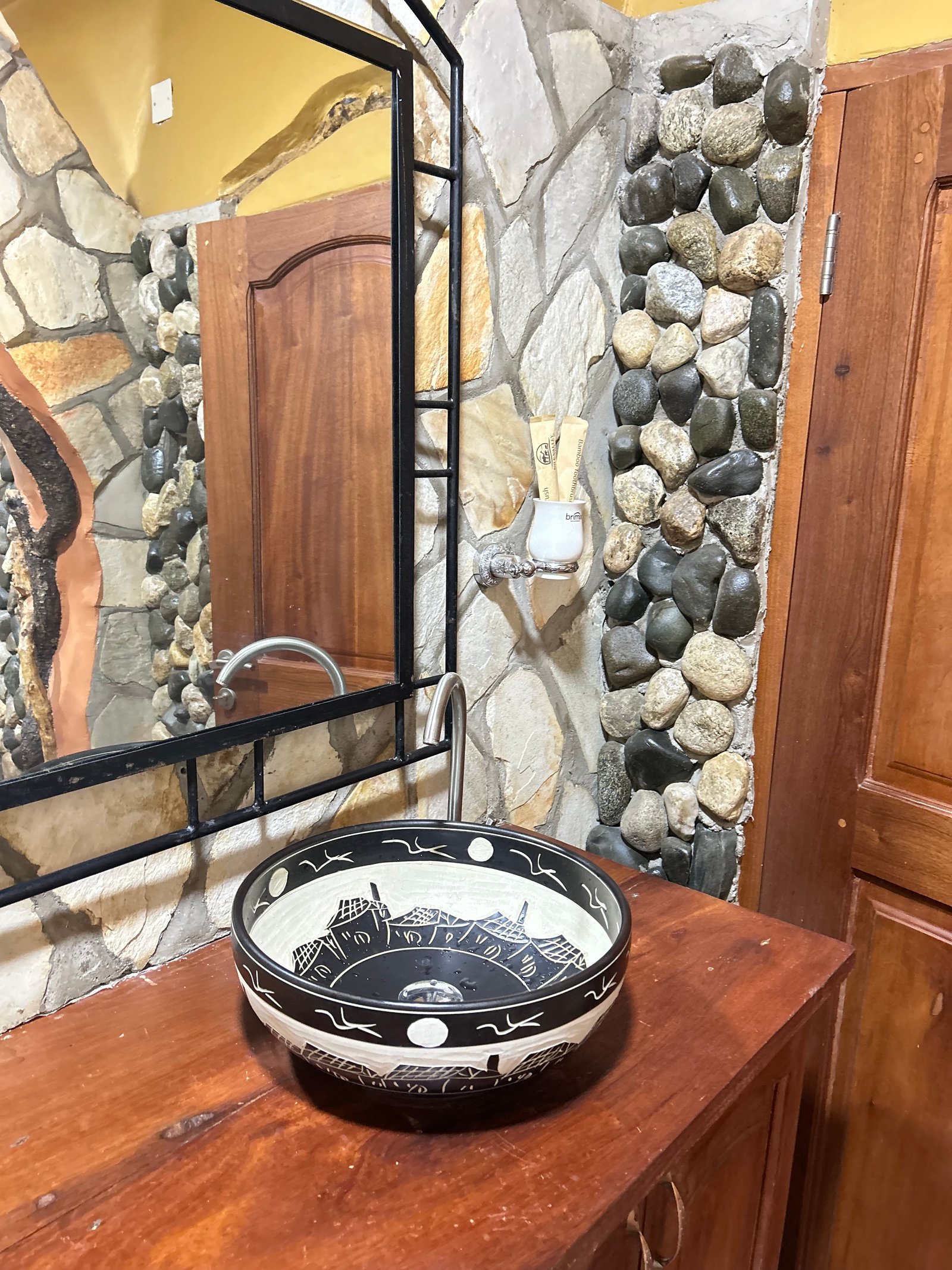 Rekemire banda ceramic sink bowl close-up at Warujojo Safari Lodge