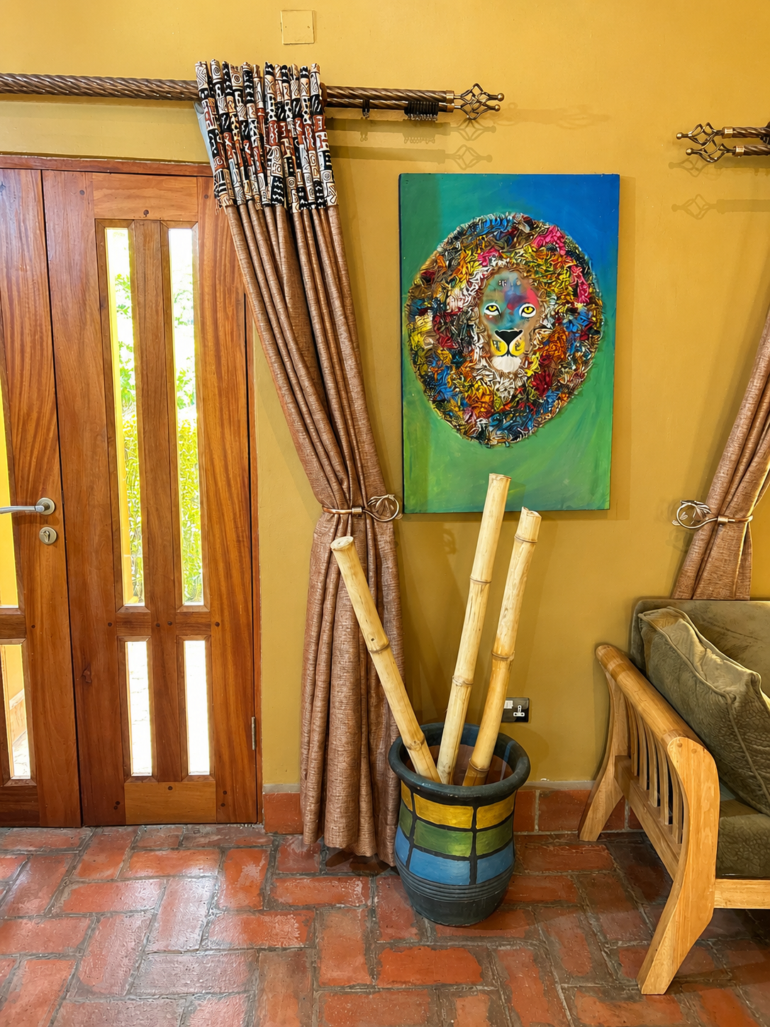 Rekemire banda entrance door with artwork and decor at Warujojo Safari Lodge