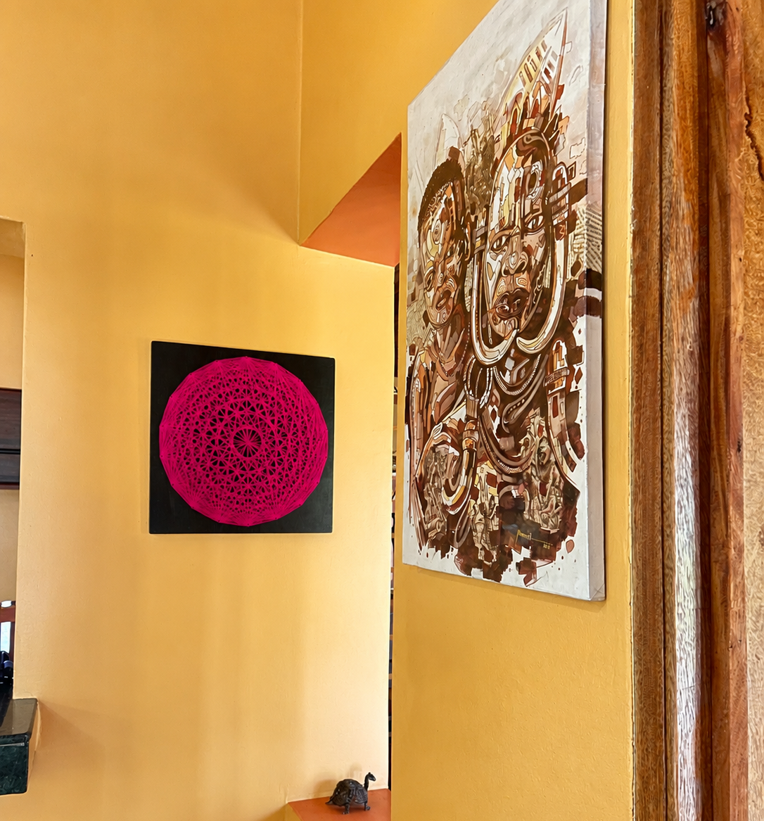 Painting of an Ankole bull with sweeping horns on the lounge wall at Warujojo Safari Lodge