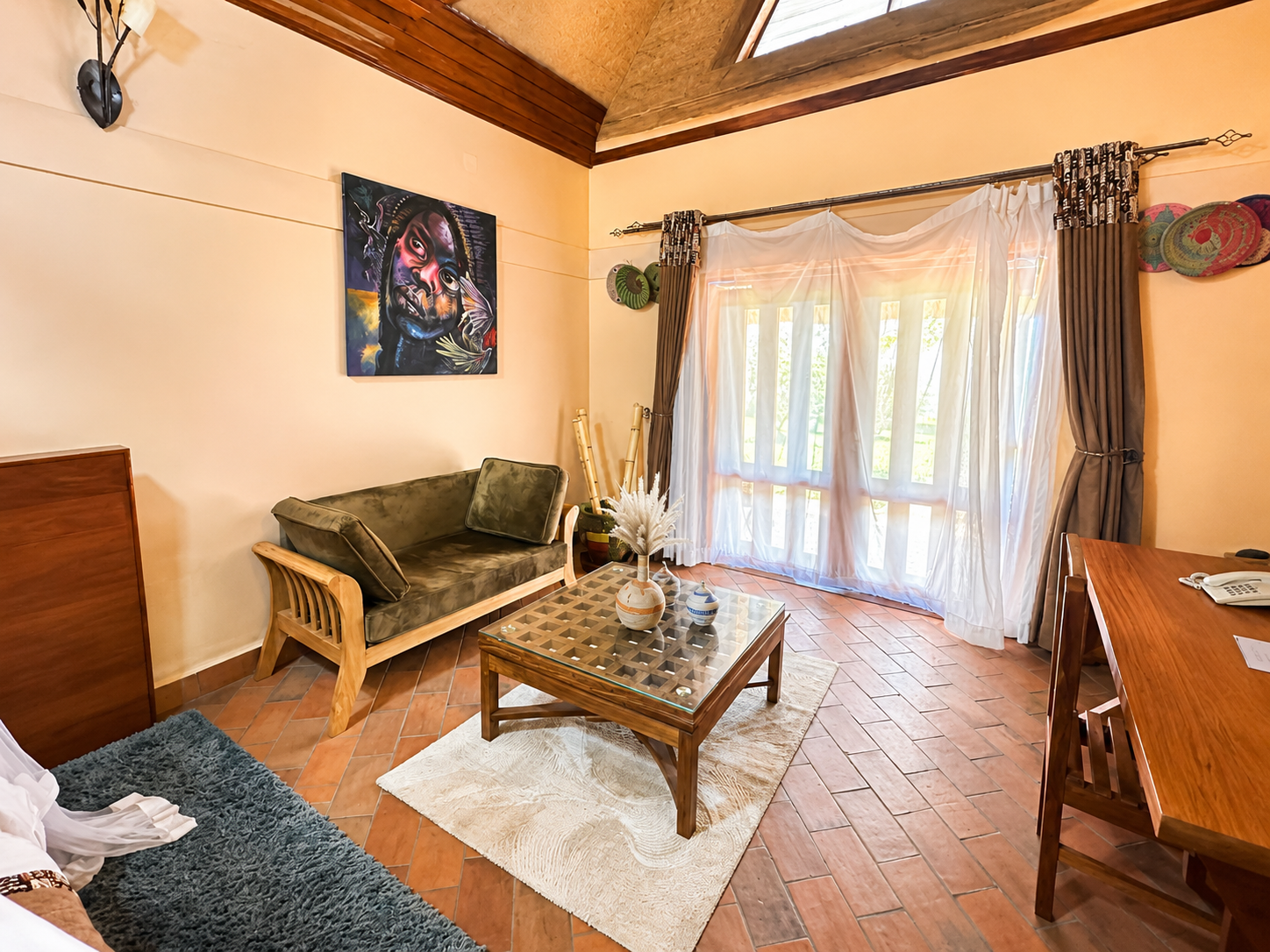 Amina cottage lounge seating area and desk at Warujojo Safari Lodge
