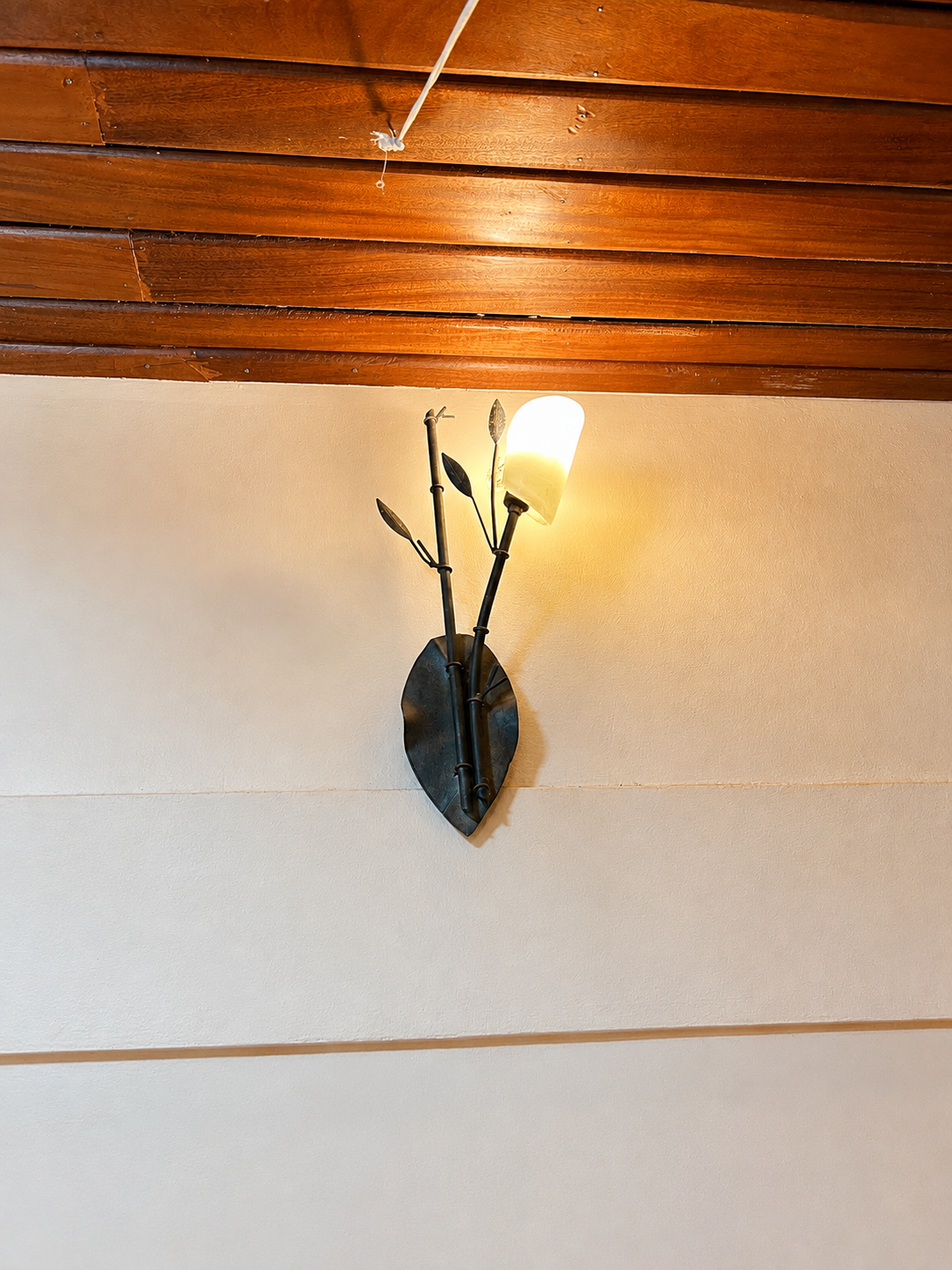 Hannibal cottage wall sconce light detail at Warujojo Safari Lodge