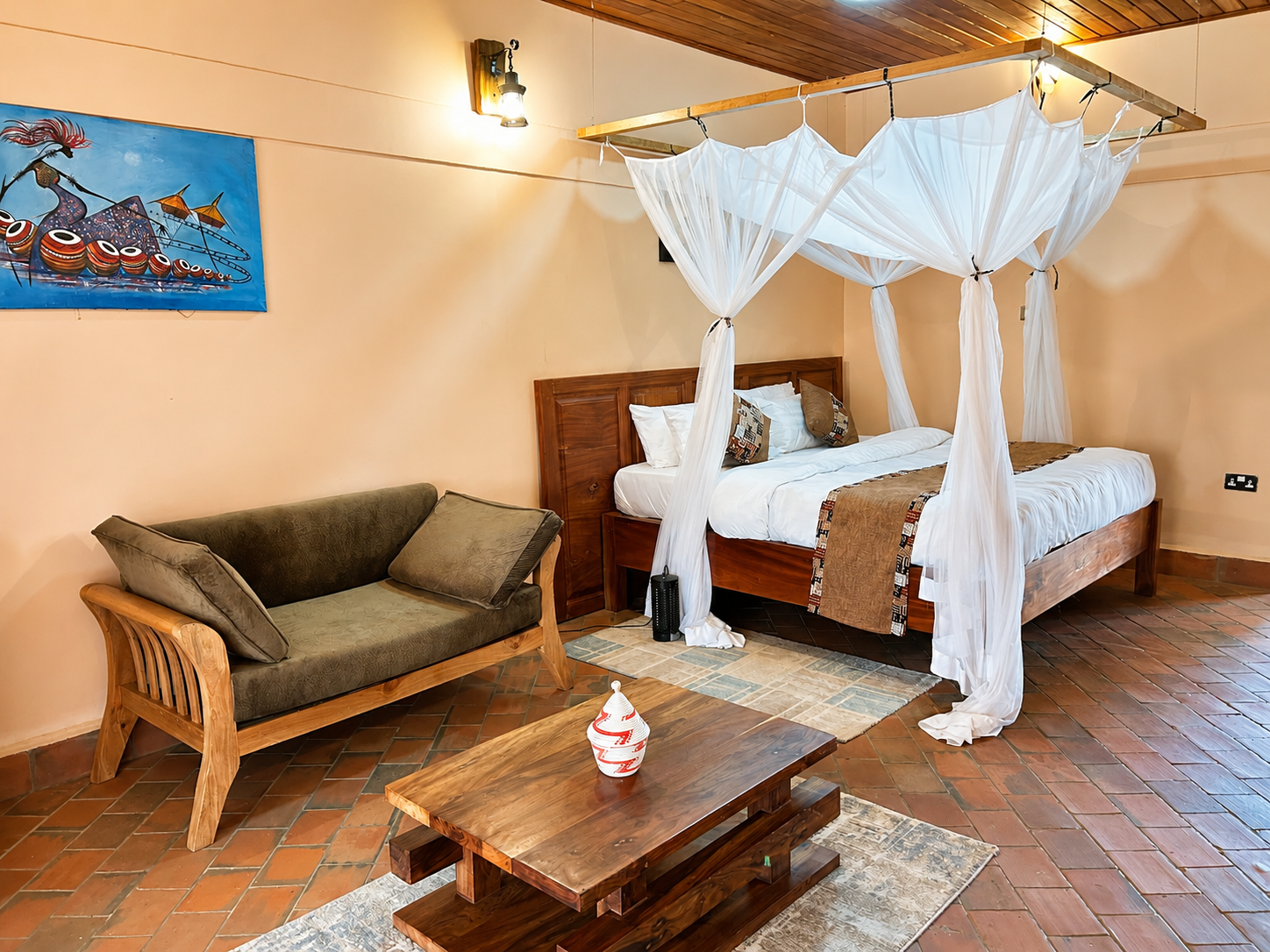 Kibalama cottage bedroom seating area at Warujojo Safari Lodge
