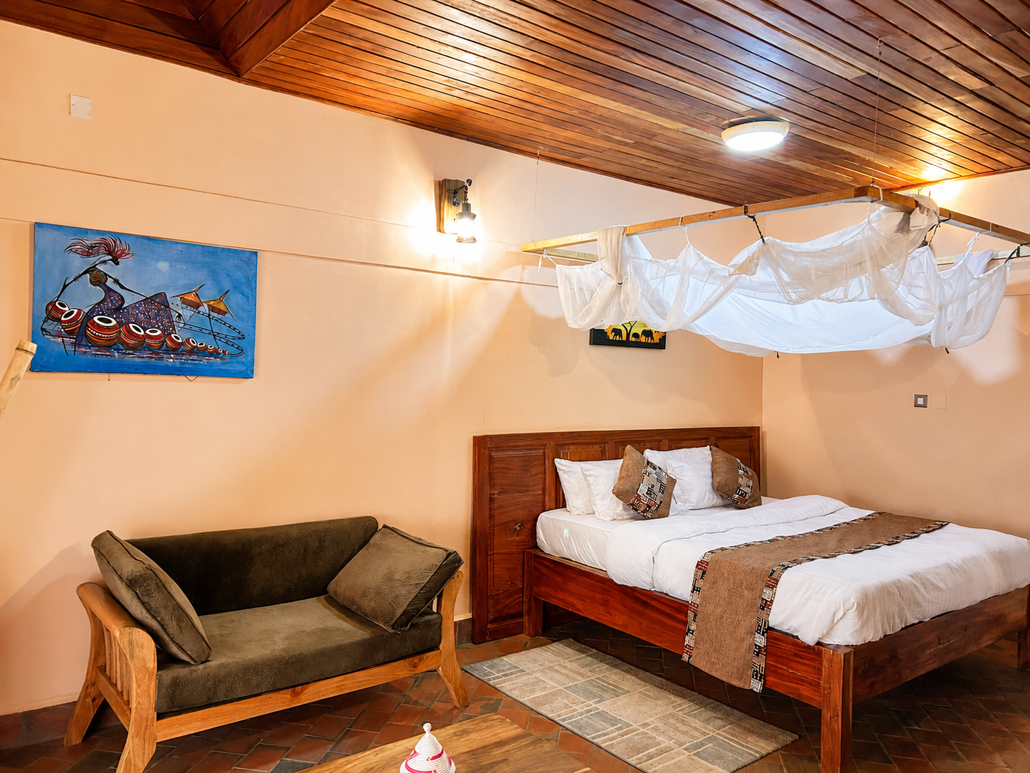Kibalama cottage bedroom sofa lounge at Warujojo Safari Lodge