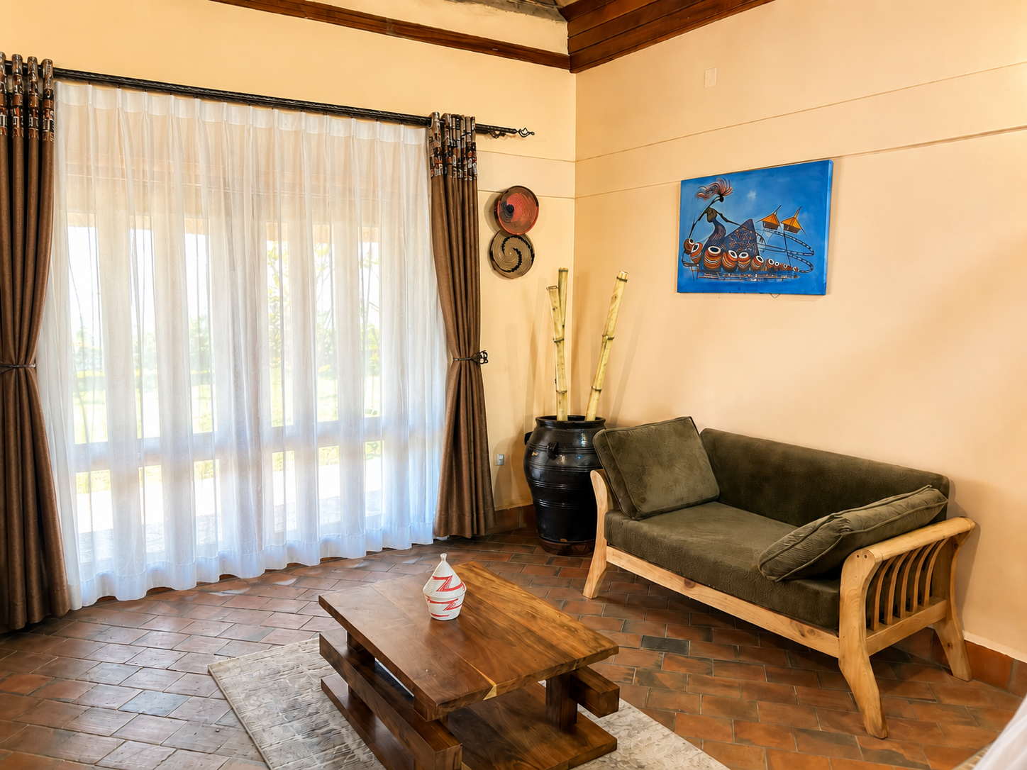Kibalama cottage lounge window with garden view at Warujojo Safari Lodge