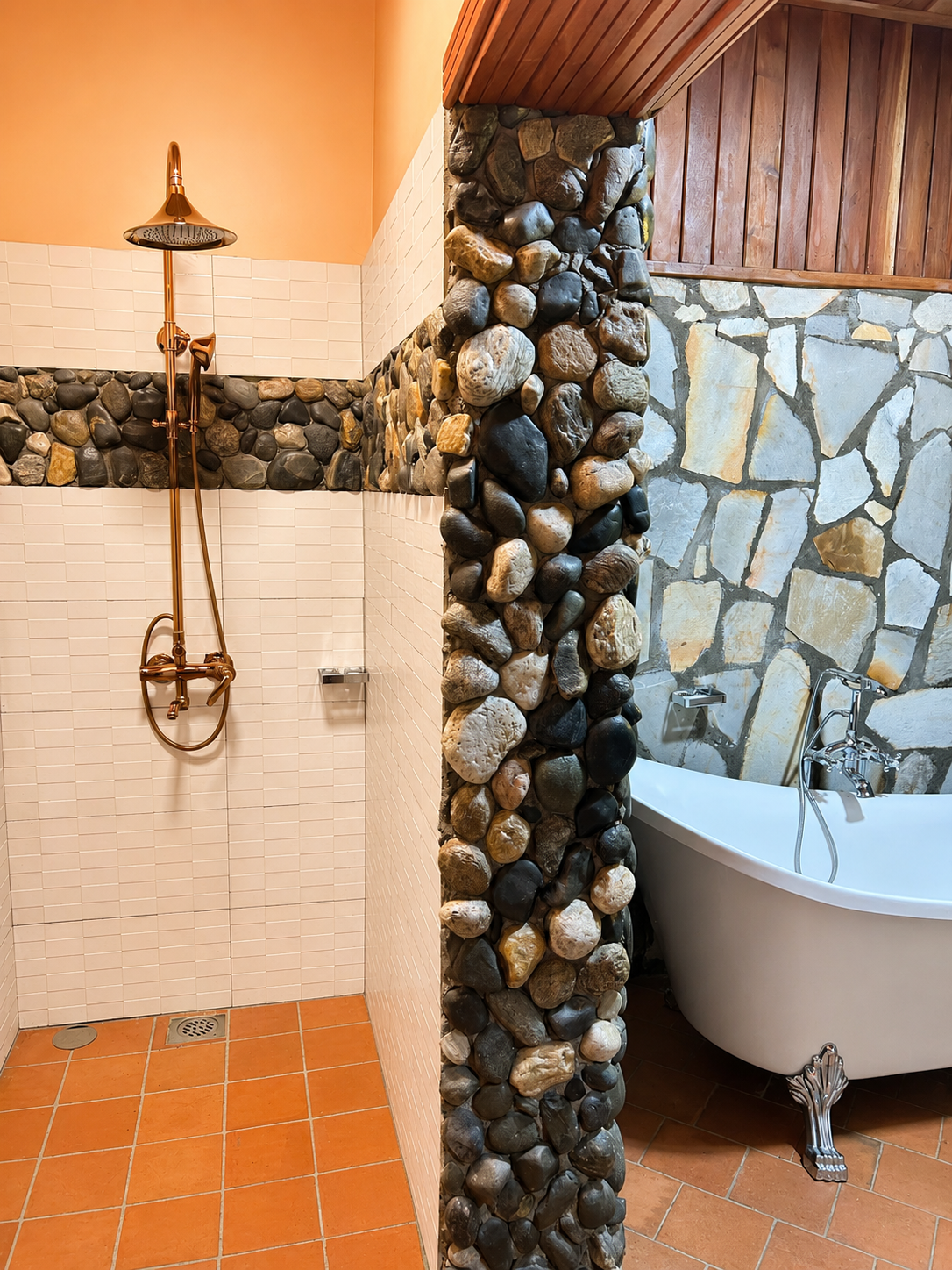 Menelik cottage bathroom stone shower and tub at Warujojo Safari Lodge