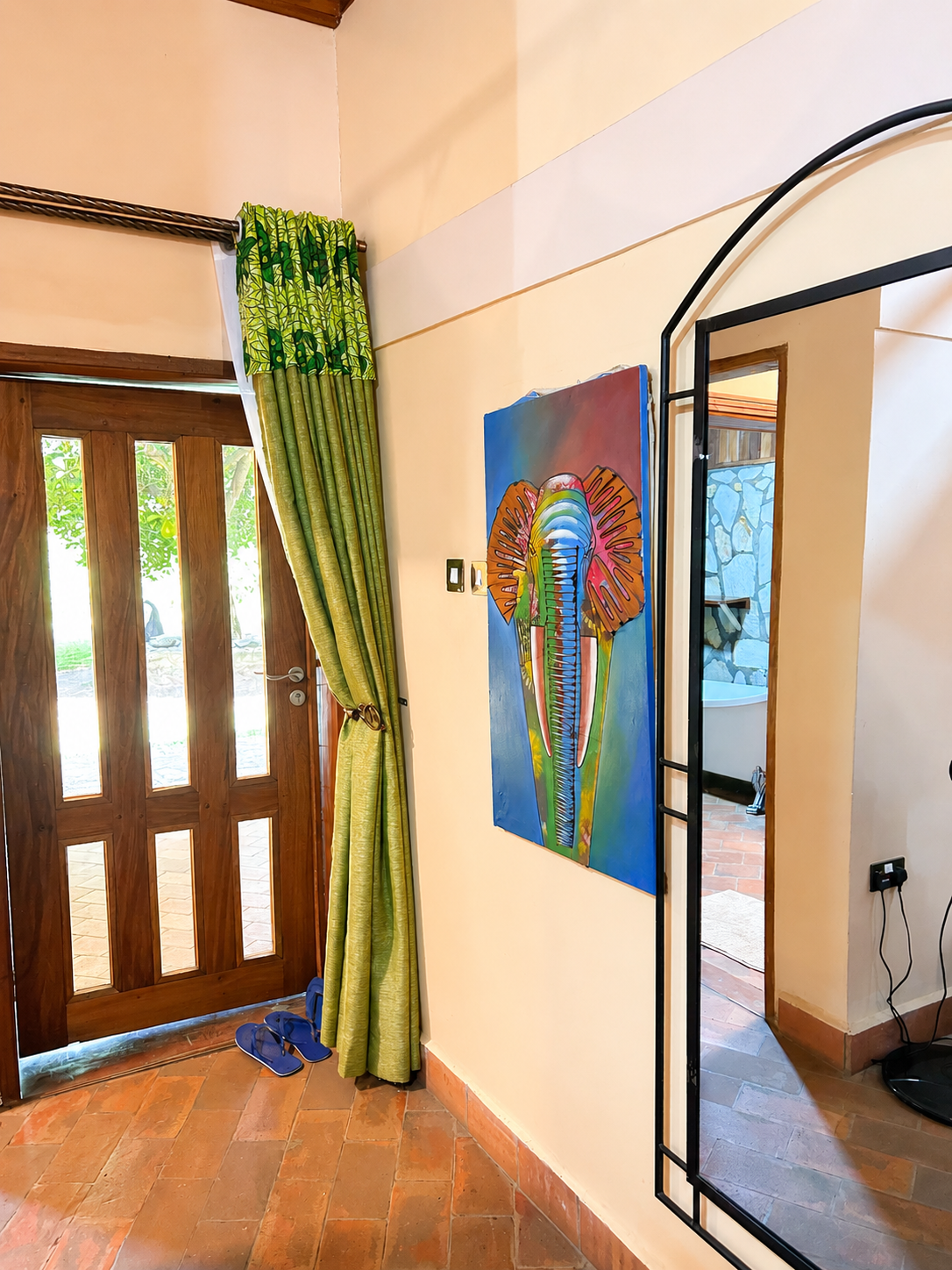 Menelik cottage entry hallway decor at Warujojo Safari Lodge