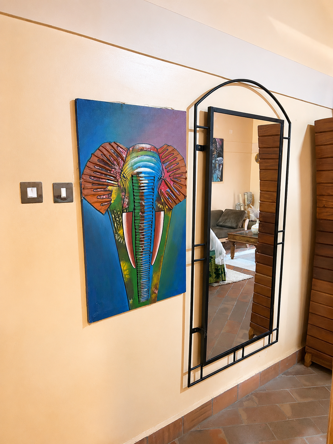 Wall art and mirror decor in Menelik at Warujojo Safari Lodge