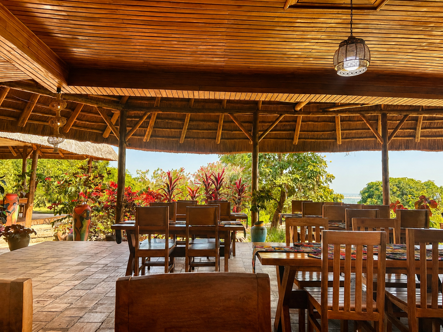 Open-air dining terrace overlooking Queen Elizabeth National Park at Warujojo Safari Lodge