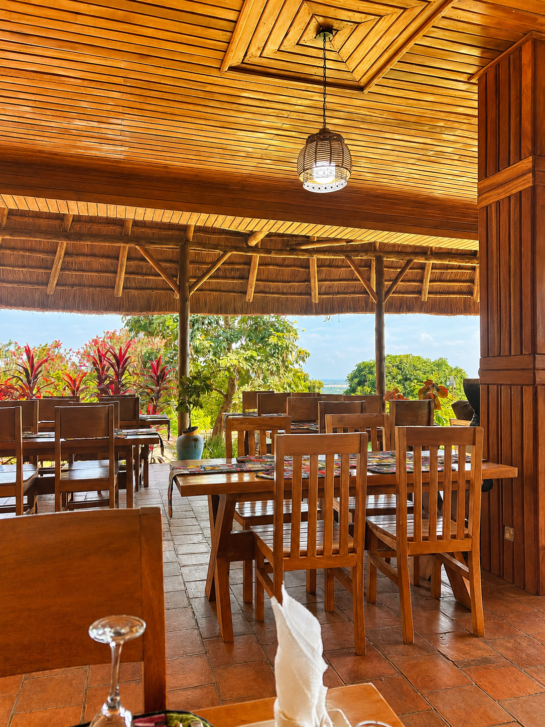 Thatched terrace looking toward Kyambura Gorge from Warujojo Safari Lodge