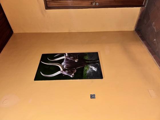 Painting of an Ankole bull on the lounge wall at Warujojo Safari Lodge