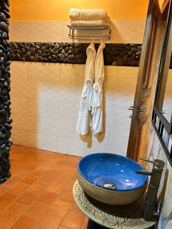 Bathrobes hanging in Hannibal cottage at Warujojo Safari Lodge