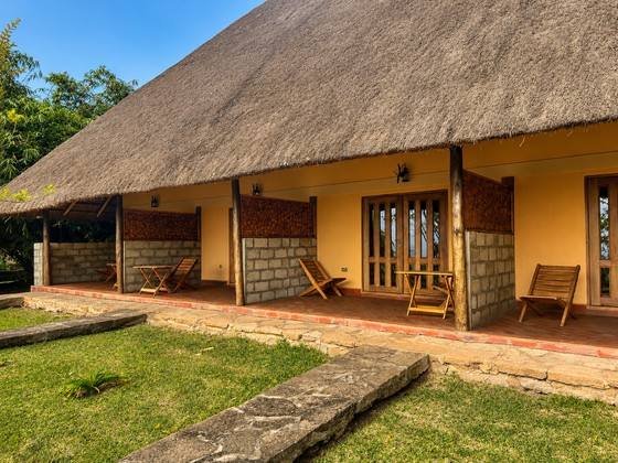 Timber doors opening onto a private veranda at Warujojo Safari Lodge