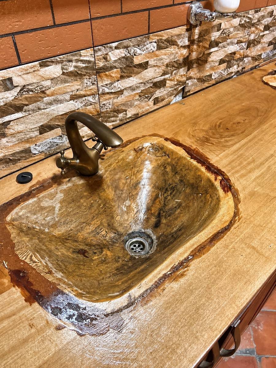 Hand-carved stone basin with an antique tap in Saraunya banda at Warujojo Safari Lodge